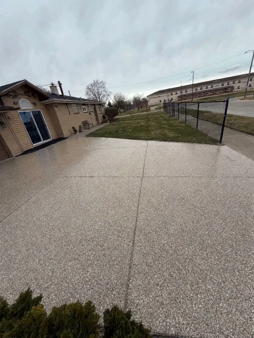 Flake epoxy coated residential driveway built to handle vehicle loads