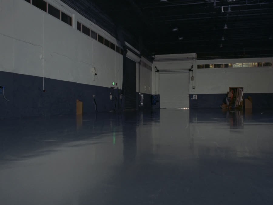 AI-generated example of a solid color epoxy warehouse floor finish